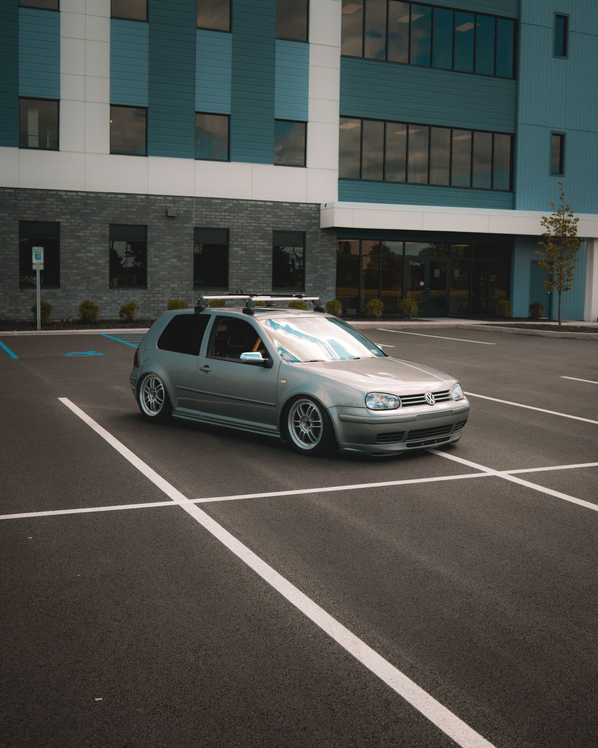 Marked parking spaces beside an office building.