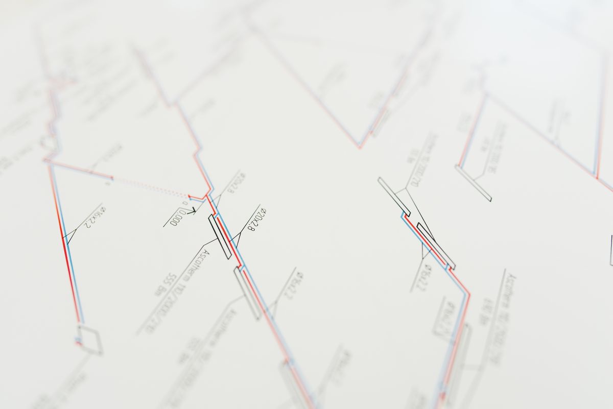Close view of technical drawings printed on paper.